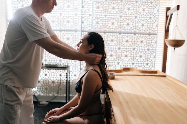 puerto pollensa gym -  - side view relaxed female client getting head neck massage by unrecognizable professional 482921 14605